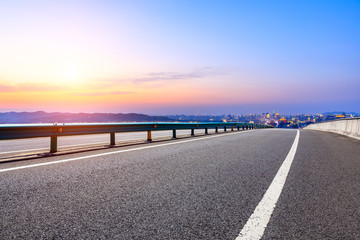 Naklejka premium Asphalt highway passing through the city above in Hangzhou at sunset