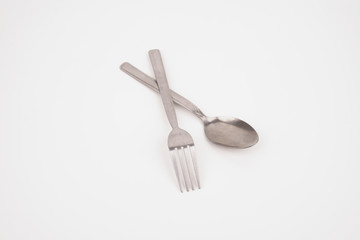 Steel silver fork and spoon isolated on white background