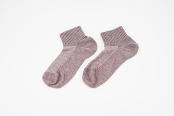 A pair of grey socks isolated on white background