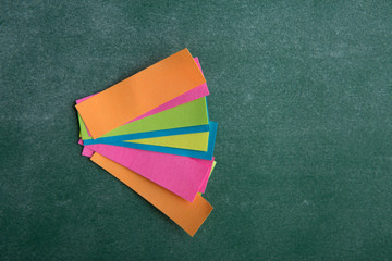 Colorful sticky notes on the blank blackboard
