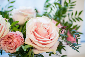 delicate bouquet of pink and beige peony and spray roses