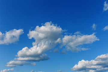 Naklejka na ściany i meble beautiful blue sky with white cumulus clouds to the horizon