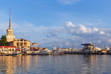 Fototapeta premium white motor boats in the seaport of the city of Sochi on a background marine station
