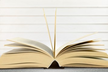 Open book on old wooden table