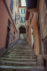 Fototapeta na wymiar Italian narrow streets with stairs, Lake Como. Alps, Italy, Lombardi, Europe.