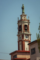 Fototapeta na wymiar Bell tower of the Catholic Church, Milan, Italy