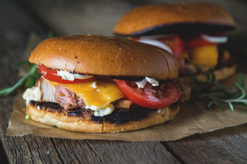 Cheeseburger with chopped meat, cheese and vegetables