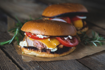 Cheeseburger with chopped meat, cheese and vegetables