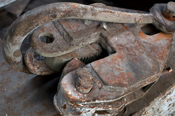 lifting hook with clip. Detail of a lifting machine with a clamping mechanism. old rusty hoist...