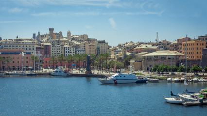 Fototapeta na wymiar Harbor of Genoa. Porto Antico, Il Bigo. Liguria, Italy. Old harbor of Genoa. The port area was redeveloped by Italian architect Renzo Piano.