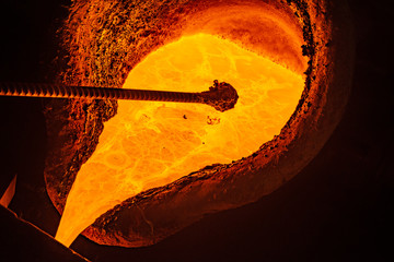 metal casting process with high temperature fire in metal part factory