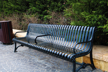 Black iron bench at the park