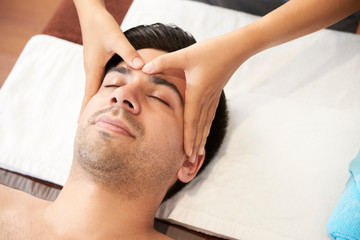 Fototapeta na wymiar Face massage at spa salon