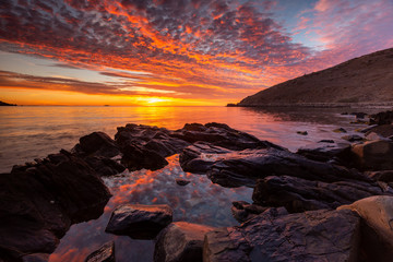 Fototapeta na wymiar A vibrant sunrise at Encounter Bay on the Fleurieu Peninsula South Australia on 3rd April 2019