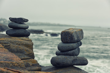 Stones folded in a pile on the ocean coast.