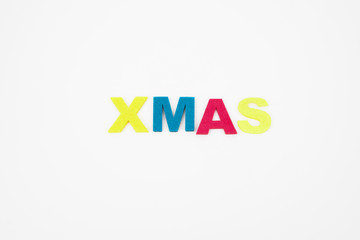 Color alphabet letter in word xmas (Abbreviation of Christmas) on isolated white background
