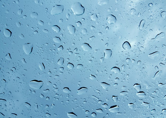 Water drops on a glass background texture.Droplets on a transparent surface.