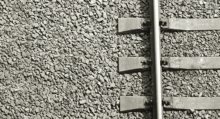 Fragment of the old railway track close-up. View from above. Background freight transport.