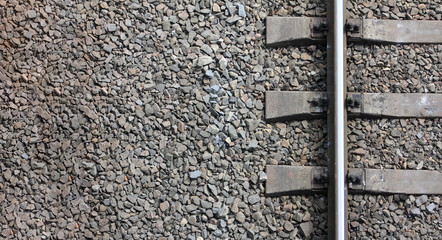 Fragment of the old railway track close-up. View from above. Background freight transport.