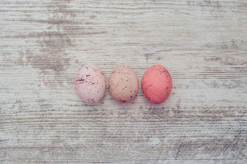 Easter eggs on marble background. A sprig of greenery.Place for inscription. top view
