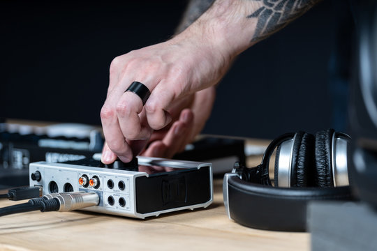 Dj man creates electronic music in the studio