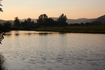 Naklejka premium sunset on the river