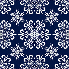 Floral seamless pattern. White design on deep blue background