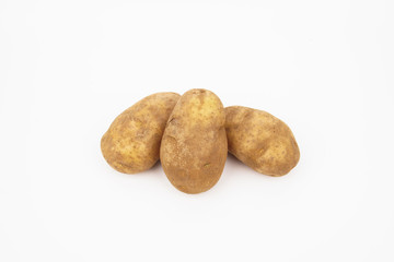 Fototapeta na wymiar Three raw russet potatoes isolated on white background