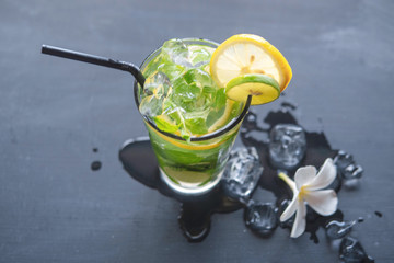 Mojito cocktail on dark stone table. Top view with copy space for your text