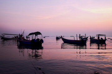 morning view of sunrise on the Penang Malaysia. The boat that was splashed in the morning sun looked silhouette against the background