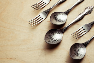 Set of retro engraved forks and spoons. Dynamic concept.