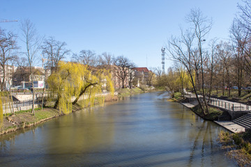 Fototapeta na wymiar Spring embankment of the river Oder on a sunny day, Poland