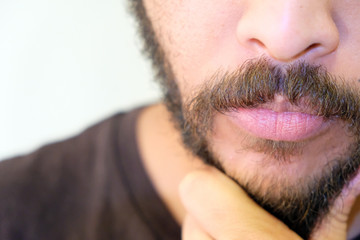 Mixed Race Man with beard close up portrait