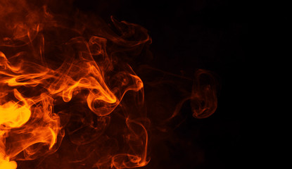 Texture of burn fire. Flames on isolated black background. Texture for banner,flyer,card . - obrazy, fototapety, plakaty