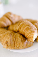 Fresh croissant on a white background. Top view Copy space