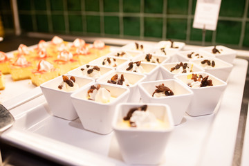 Tray of rations of lemon mousse with raisins