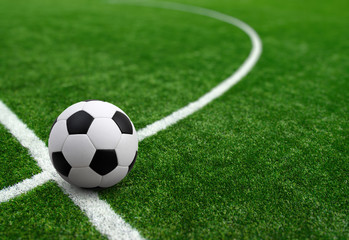 Plakat Soccer ball on green football field