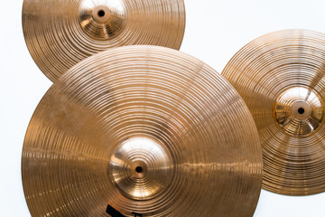 Drum plate, drum set on a white background, musical cymbals top view