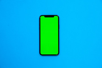 iPhone XS, smartphone, green screen on Blue background