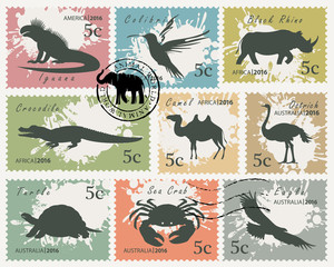 Vector set of postage stamps on the theme of wildlife animals and birds. Silhouettes of various animals on on an abstract background with spots in retro style