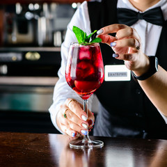 Bartender making Red Sangria in Italian restaurant.