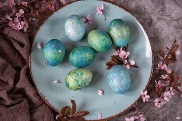 Fototapeta na wymiar Easter eggs with flowering twigs .Spring theme