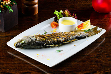 Baked seabass with Greek salad