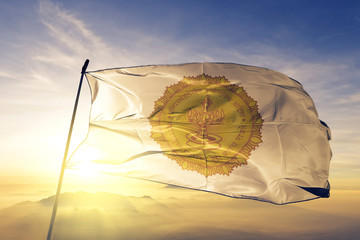 Maharashtra state of India flag waving on the top sunrise mist fog