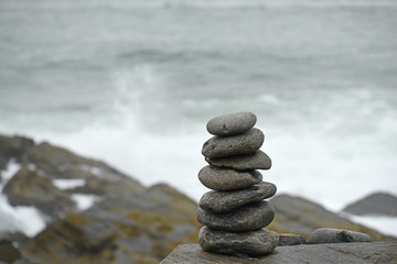 Stones folded in a pile on the ocean coast.