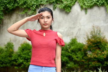 Fototapeta premium Diverse Female Youngster Saluting