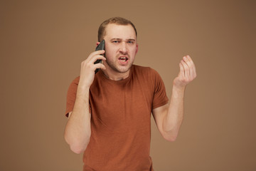 funny man talking on the phone is angry