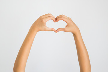 Obraz premium heart in hands isolated on white background