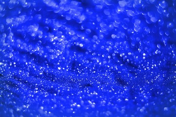 blue sparkling brassy sand made of glitters - festal concept with bokeh texture - wonderful abstract photo background