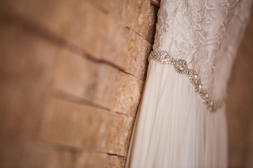 Wedding dress hanged on wall